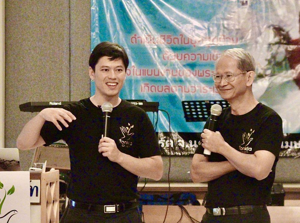 Pastor Steve Cioccolanti teaching at Tonkla Church in Thailand with translation